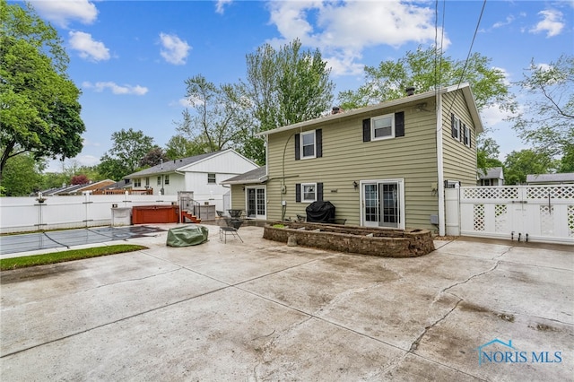 832 Maple Ln, Waterville, OH 43566 - back of property featuring a hot tub and a patio