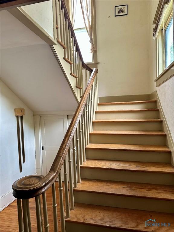 202 E Montford Ave, Ada, OH 45810 - staircase featuring wood finished floors and baseboards