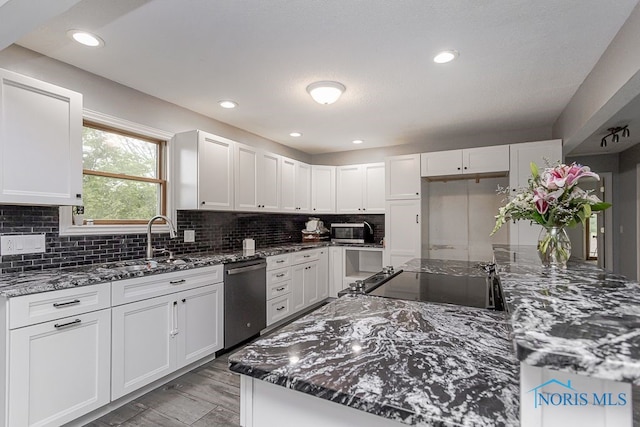 17315 County Road R, Napoleon, OH 43545 - kitchen with stainless steel appliances, a sink, white cabinetry, dark stone countertops, and recessed lighting