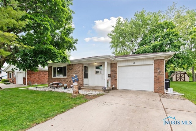 417 Indian Rd, Wauseon, OH 43567 - view of front facade with an attached garage, a front yard, concrete driveway, brick siding, and a storage shed
