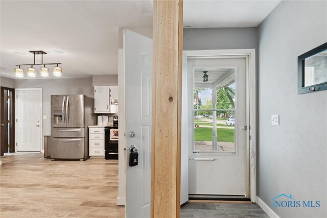 417 Indian Rd, Wauseon, OH 43567 - entryway featuring light wood-style floors