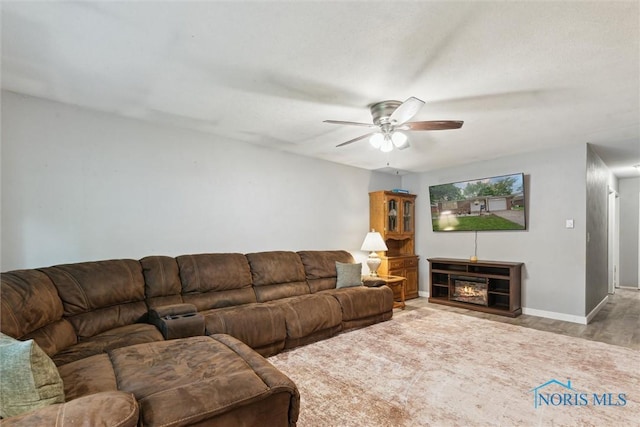 417 Indian Rd, Wauseon, OH 43567 - living room featuring a ceiling fan, wood finished floors, and baseboards