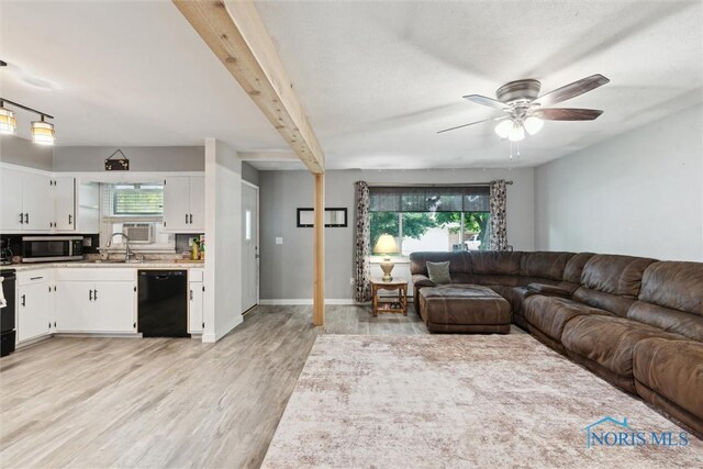 417 Indian Rd, Wauseon, OH 43567 - living room featuring plenty of natural light, a ceiling fan, light wood-type flooring, and cooling unit