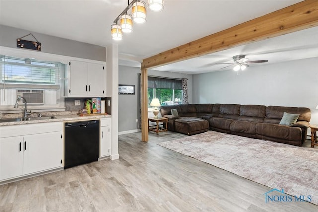417 Indian Rd, Wauseon, OH 43567 - kitchen featuring black dishwasher, a sink, white cabinetry, light wood-style floors, and beam ceiling