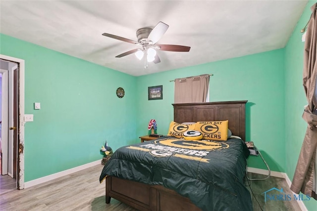 417 Indian Rd, Wauseon, OH 43567 - bedroom featuring baseboards, light wood-style flooring, and a ceiling fan