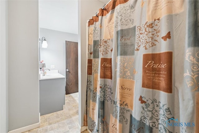 417 Indian Rd, Wauseon, OH 43567 - bathroom with vanity and stone finish floors
