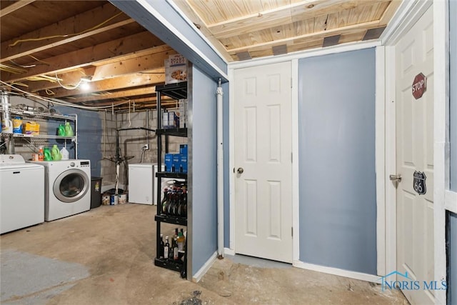 417 Indian Rd, Wauseon, OH 43567 - unfinished basement featuring independent washer and dryer, refrigerator, and baseboards