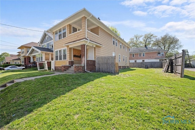rear view of property featuring brick siding