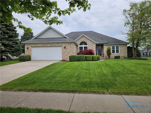 5723 Timbers Grn, Waterville, OH 43566 - single story home featuring brick siding, driveway, a front yard, and an attached garage