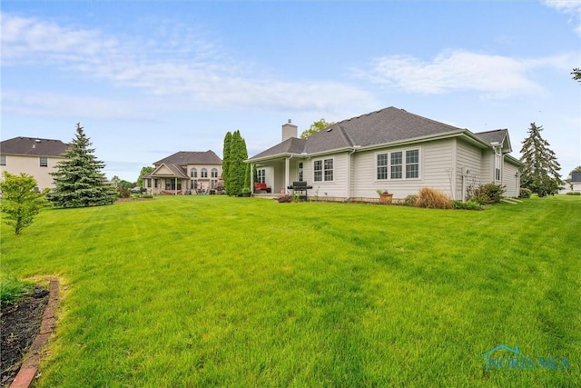 5723 Timbers Grn, Waterville, OH 43566 - back of property with a lawn and a chimney