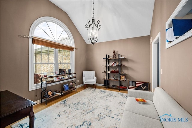 5723 Timbers Grn, Waterville, OH 43566 - sitting room featuring a chandelier, vaulted ceiling, wood finished floors, and baseboards