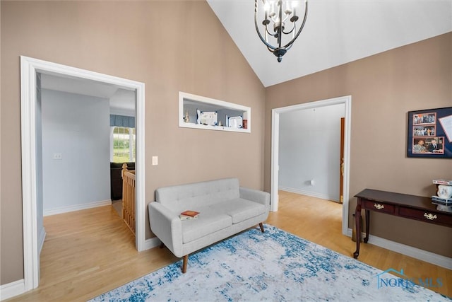5723 Timbers Grn, Waterville, OH 43566 - sitting room featuring a chandelier, light wood-style floors, baseboards, an upstairs landing, and high vaulted ceiling