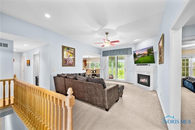 5723 Timbers Grn, Waterville, OH 43566 - carpeted living area featuring ceiling fan, plenty of natural light, baseboards, recessed lighting, and a premium fireplace