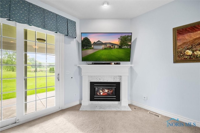 5723 Timbers Grn, Waterville, OH 43566 - unfurnished living room featuring a fireplace, carpet floors, and baseboards