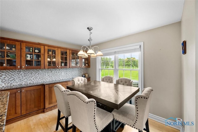 5723 Timbers Grn, Waterville, OH 43566 - dining room with light wood-style flooring and a chandelier