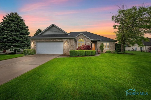 5723 Timbers Grn, Waterville, OH 43566 - single story home featuring driveway, a lawn, brick siding, and a garage