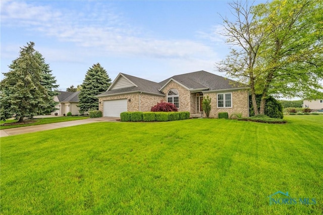 5723 Timbers Grn, Waterville, OH 43566 - single story home featuring driveway, brick siding, a front lawn, and a garage