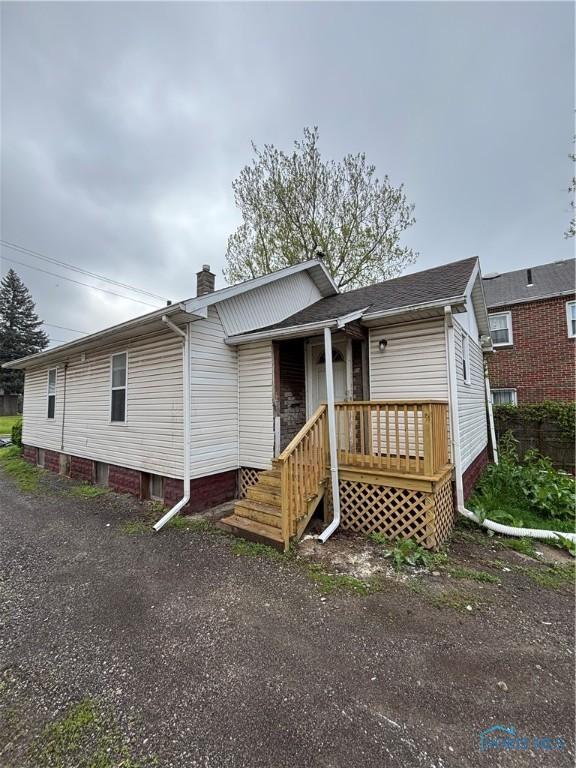 3907 Lagrange St, Toledo, OH 43612 - view of front of home featuring a chimney and covered porch