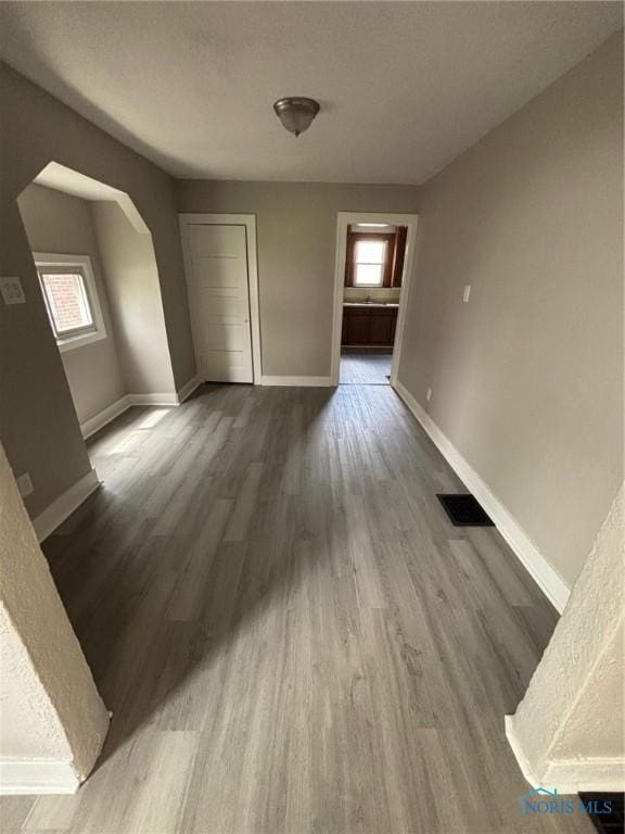3907 Lagrange St, Toledo, OH 43612 - unfurnished dining area with plenty of natural light, wood finished floors, and baseboards