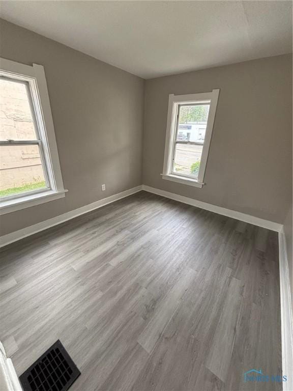 3907 Lagrange St, Toledo, OH 43612 - unfurnished room featuring wood finished floors and baseboards