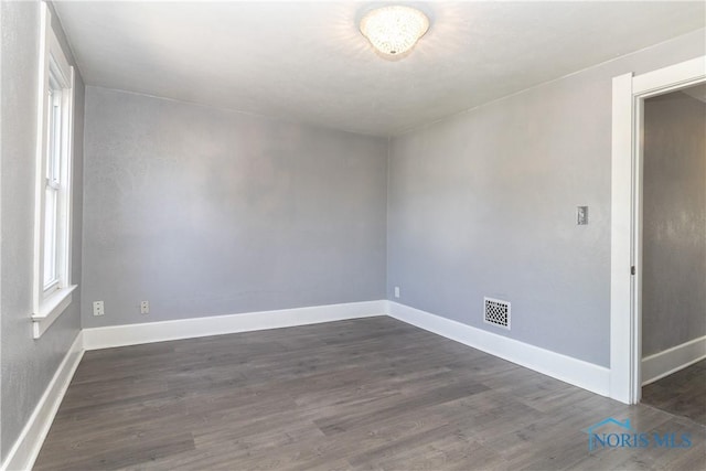4202 Asbury Dr, Toledo, OH 43612 - empty room featuring dark wood finished floors and baseboards