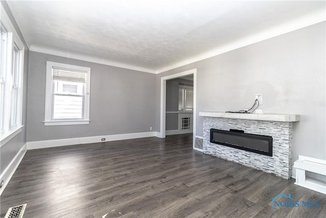 4202 Asbury Dr, Toledo, OH 43612 - unfurnished living room with a fireplace, baseboards, and dark wood-style floors