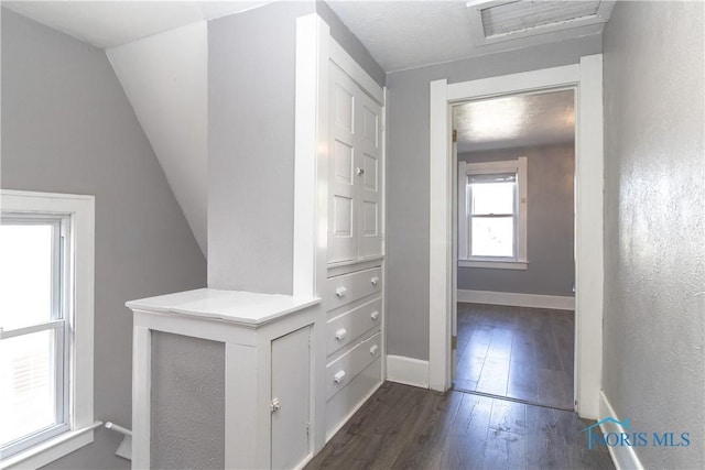 4202 Asbury Dr, Toledo, OH 43612 - corridor with dark wood-style floors, baseboards, and vaulted ceiling