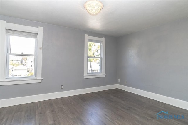 4202 Asbury Dr, Toledo, OH 43612 - empty room featuring dark wood-style flooring and baseboards