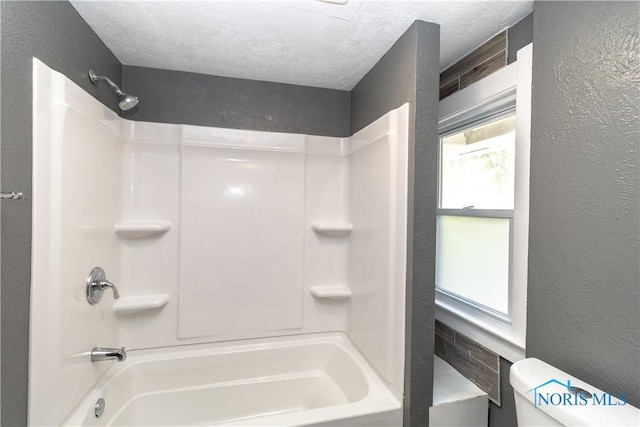4202 Asbury Dr, Toledo, OH 43612 - full bathroom featuring toilet, a textured wall, and shower / tub combination