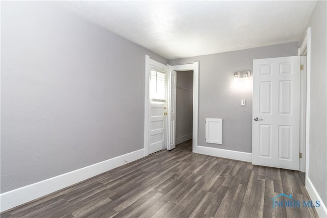 4202 Asbury Dr, Toledo, OH 43612 - unfurnished bedroom with baseboards, wood finished floors, and a closet