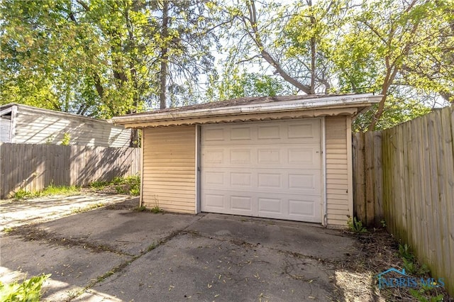 4202 Asbury Dr, Toledo, OH 43612 - detached garage featuring fence and concrete driveway