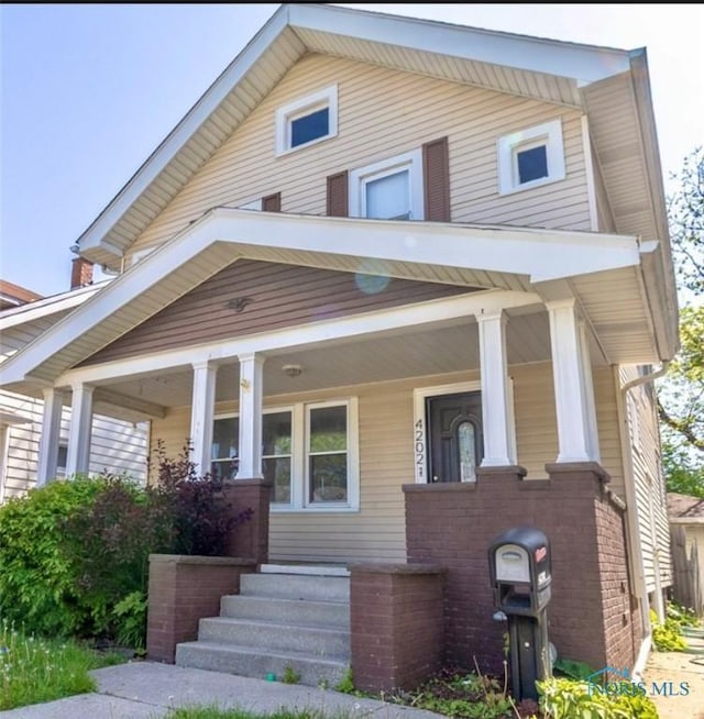 4202 Asbury Dr, Toledo, OH 43612 - view of front of property with a porch and brick siding