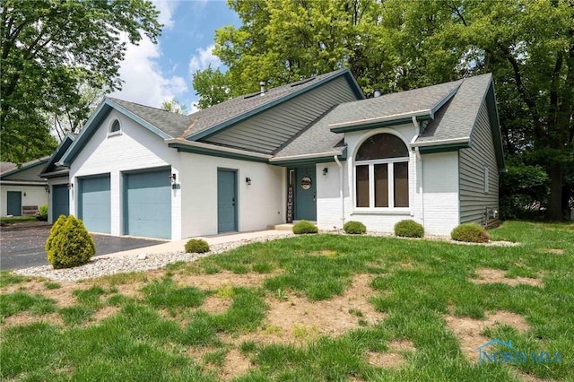 2008 Rush Creek Ct, Findlay, OH 45840 - ranch-style house with a shingled roof, brick siding, a garage, and a front yard