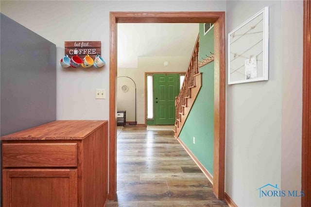 2008 Rush Creek Ct, Findlay, OH 45840 - hall with stairs, wood finished floors, and baseboards