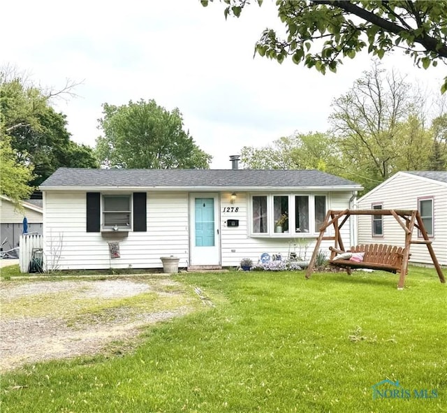 ranch-style house with a front lawn