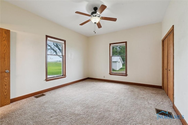 2454 Adams Ridge Rd, Defiance, OH 43512 - empty room with carpet, baseboards, and ceiling fan