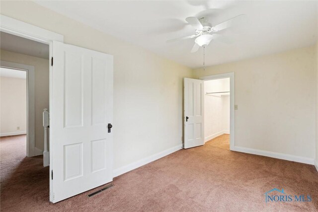 2454 Adams Ridge Rd, Defiance, OH 43512 - unfurnished bedroom featuring carpet floors, baseboards, and a ceiling fan
