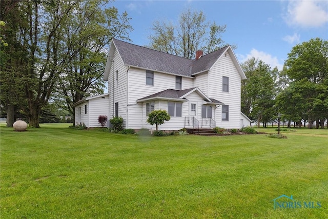 2454 Adams Ridge Rd, Defiance, OH 43512 - view of front of house featuring a shingled roof, a chimney, and a front yard