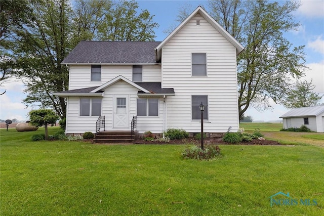 2454 Adams Ridge Rd, Defiance, OH 43512 - rear view of property with a lawn and a shingled roof