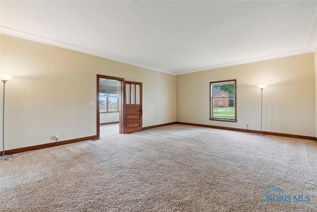 2454 Adams Ridge Rd, Defiance, OH 43512 - empty room featuring light colored carpet, baseboards, and crown molding