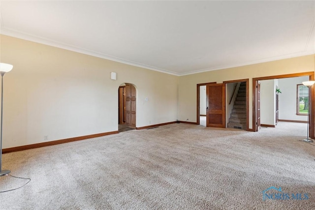 2454 Adams Ridge Rd, Defiance, OH 43512 - carpeted spare room featuring arched walkways, baseboards, stairs, and ornamental molding