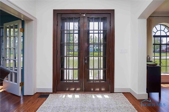 218 E Mcpherson Ave, Findlay, OH 45840 - entryway featuring french doors, baseboards, and wood finished floors
