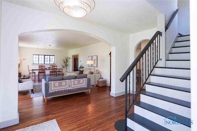 218 E Mcpherson Ave, Findlay, OH 45840 - entrance foyer with arched walkways, wood finished floors, stairs, and baseboards
