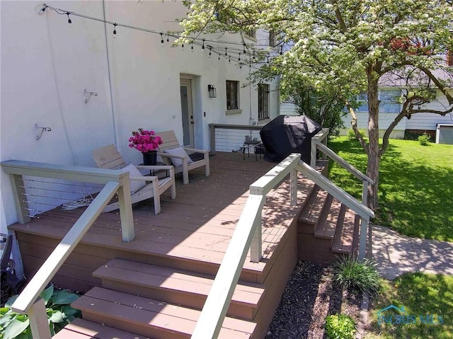 218 E Mcpherson Ave, Findlay, OH 45840 - deck with stairway, a lawn, and area for grilling