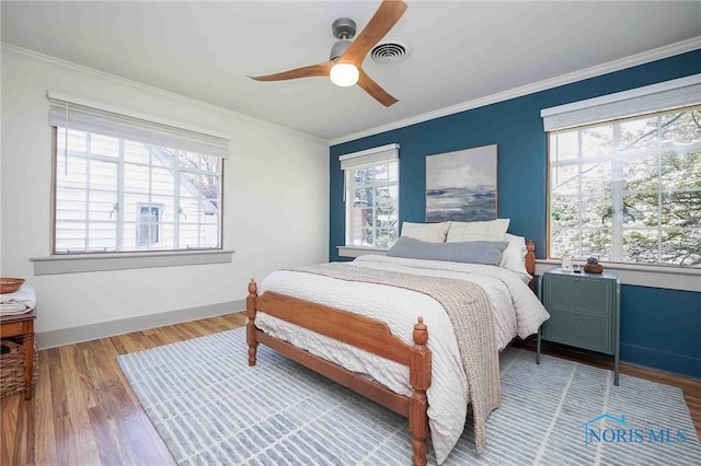 218 E Mcpherson Ave, Findlay, OH 45840 - bedroom with wood finished floors, ornamental molding, ceiling fan, and baseboards