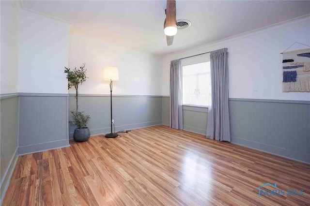 218 E Mcpherson Ave, Findlay, OH 45840 - empty room with wood finished floors, wainscoting, ornamental molding, and baseboards
