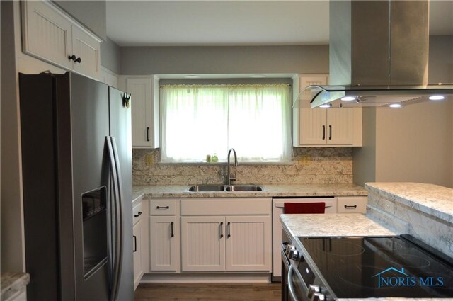 309 Huron Rd, Findlay, OH 45840 - kitchen featuring stainless steel fridge, wall chimney exhaust hood, a sink, electric range, and backsplash