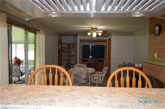 309 Huron Rd, Findlay, OH 45840 - dining space featuring a fireplace and a ceiling fan