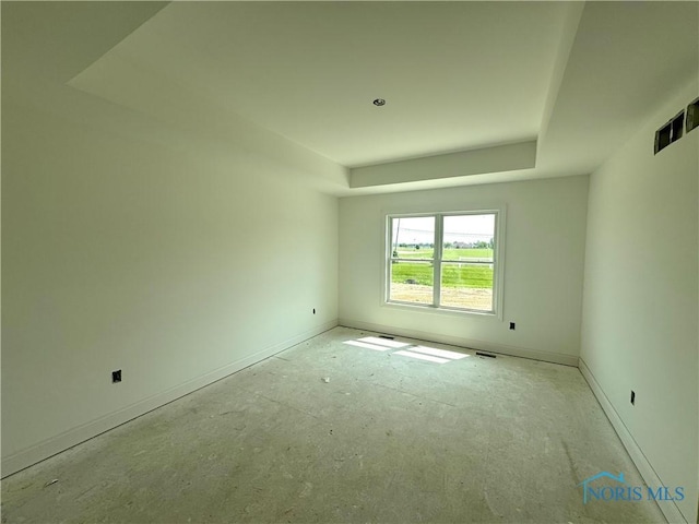 1902 Caleb Ct, Waterville, OH 43566 - spare room featuring a tray ceiling and baseboards