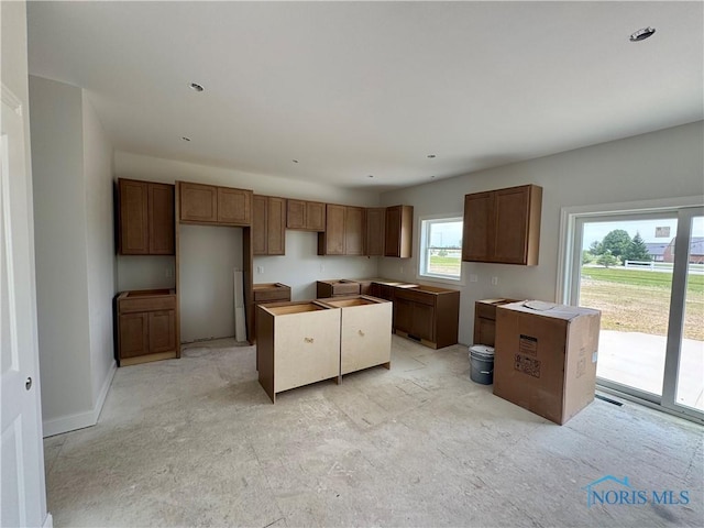 1924 Caleb Ct, Waterville, OH 43566 - kitchen with a kitchen island, recessed lighting, and brown cabinets
